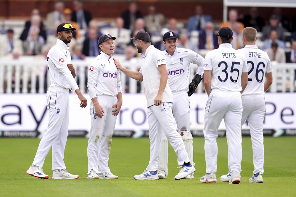 | Photo: John Walton/PA via AP : England Vs Sri Lanka 2nd Test Day 2: England's Ollie Pope, second left, celebrates with teammates after running out Sri Lanka's Lahiru Kumara